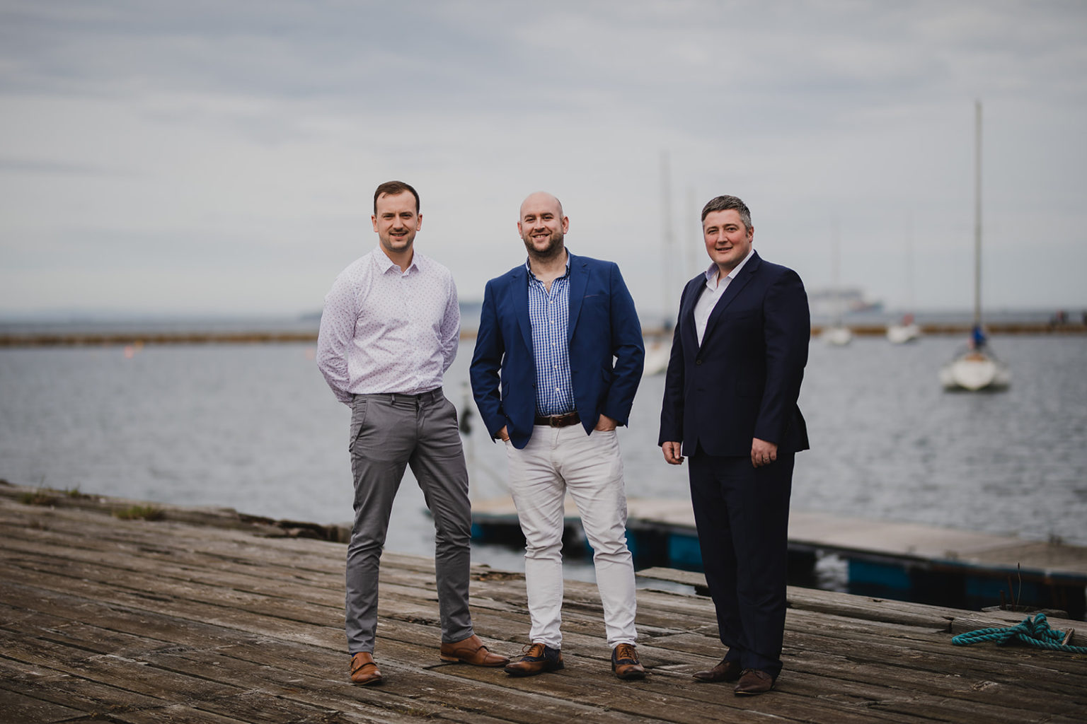 inver property group team standing on pier